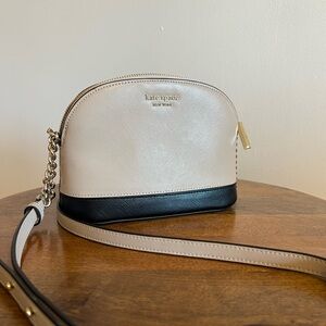 Kate Spade dome crossbody purse. Nude/beige and black color